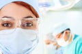 Young female doctor in operation room with her team Royalty Free Stock Photo