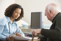 Young female Doctor with senior male patient Royalty Free Stock Photo