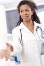 Young female doctor shaking hands Royalty Free Stock Photo