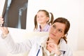 Young female doctor show x-ray to child Royalty Free Stock Photo