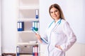 The young female doctor standing in front of the white board Royalty Free Stock Photo