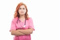 Young female doctor with stethoscope standing with arms crossed Royalty Free Stock Photo