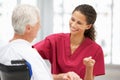 Young female doctor talking with senior patient Royalty Free Stock Photo