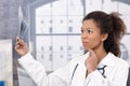 Young female doctor with x-ray image Royalty Free Stock Photo