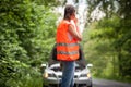 Young female driver calling the roadside service Royalty Free Stock Photo