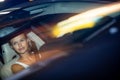 Young female driver driving her car at night Royalty Free Stock Photo