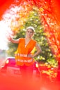 Young female driver wearing a high visibility vest, calling the roadside service Royalty Free Stock Photo