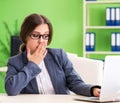 Young female employee very busy with ongoing paperwork Royalty Free Stock Photo