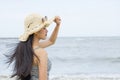 Young female enjoying sunny day on tropical beach Royalty Free Stock Photo