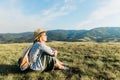 Young female enjoying the sunset in the mountains