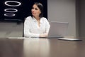 Young female executive smiling during meeting in office conference room Royalty Free Stock Photo