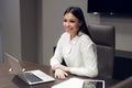 Young female executive smiling during meeting in office conference room Royalty Free Stock Photo