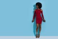 Young African Female Model Is Posing In Elegant Red Mini Dress And High Heels Sandals Royalty Free Stock Photo