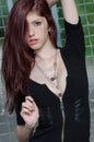 Young female fashion model with red hair and nice neckline Royalty Free Stock Photo