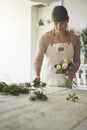 Florist making a bouquet of roses in her flower shop Royalty Free Stock Photo