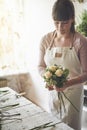 Young florist making a bouquet in her flower shop Royalty Free Stock Photo