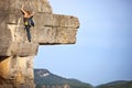 Young female free climber on a cliff Royalty Free Stock Photo