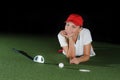 Young female golf player on artificial field at the mini golf club Royalty Free Stock Photo