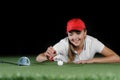 Young female golf player on artificial field at the mini golf club Royalty Free Stock Photo