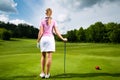 Young female golf player on course Royalty Free Stock Photo
