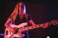 Young female guitarist performing in nightclub Royalty Free Stock Photo