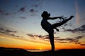 Young female gymnast exercising at sunrise Royalty Free Stock Photo
