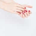 Woman showing manicures hands with red nail polish on white background copy space Royalty Free Stock Photo