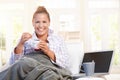 Young female having low fat breakfast in bed Royalty Free Stock Photo