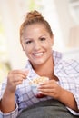 Young female having low fat breakfast in bed Royalty Free Stock Photo