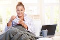 Young female having low fat breakfast in bed