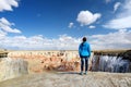 Young female hiker admiring views of stunning striped sandstone formations of Coal Mine Canyon, Arizona, USA Royalty Free Stock Photo