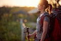 Young female hiker enjoying at sunrise in nature. healthy living, positive, nature concept