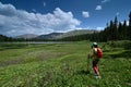 Young female hiker at Hassell Lake in Arapaho National Forest, Colorado.