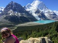 A young female hiker resting along the Berg Lake trail in British Columbia, Canada