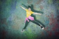 Young female hip-hop dancer jumping in studio Royalty Free Stock Photo