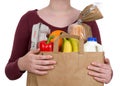 Young female holding brown eco friendly grocery bag with perishable foods Royalty Free Stock Photo