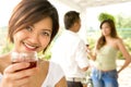 Young female host toasting