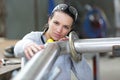 young female industrial engineer taking measures metal pipe Royalty Free Stock Photo