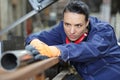 young female industrial engineer taking measures metal pipe Royalty Free Stock Photo