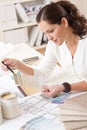 Young female interior designer working at office Royalty Free Stock Photo