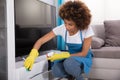 Janitor Cleaning Furniture With Sponge Royalty Free Stock Photo