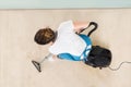 Young Female Janitor Vacuuming Floor Royalty Free Stock Photo