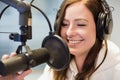 Jockey Smiling While Using Headphones And Microphone In Radio St Royalty Free Stock Photo