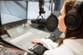 Jockey Wearing Headphones While Using Microphone In Radio Statio Royalty Free Stock Photo