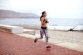 Young female jogger on the esplanade Royalty Free Stock Photo