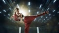 Young female kickboxing fighter training in the gym