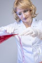 Young Female in Lab Using Glasware for Liquids Royalty Free Stock Photo