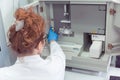 Young female Laboratory scientist working at lab with test tubes and microscope, test or research in clinical laboratory.Science, Royalty Free Stock Photo