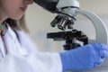 Young female Laboratory scientist working at lab with test tubes and microscope, test or research in clinical laboratory.Science, Royalty Free Stock Photo