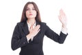 Young female lawyer making oath gesture with hand on heart